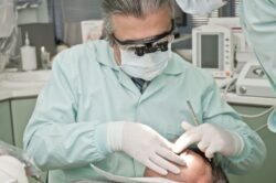 Dentists working on dental implant